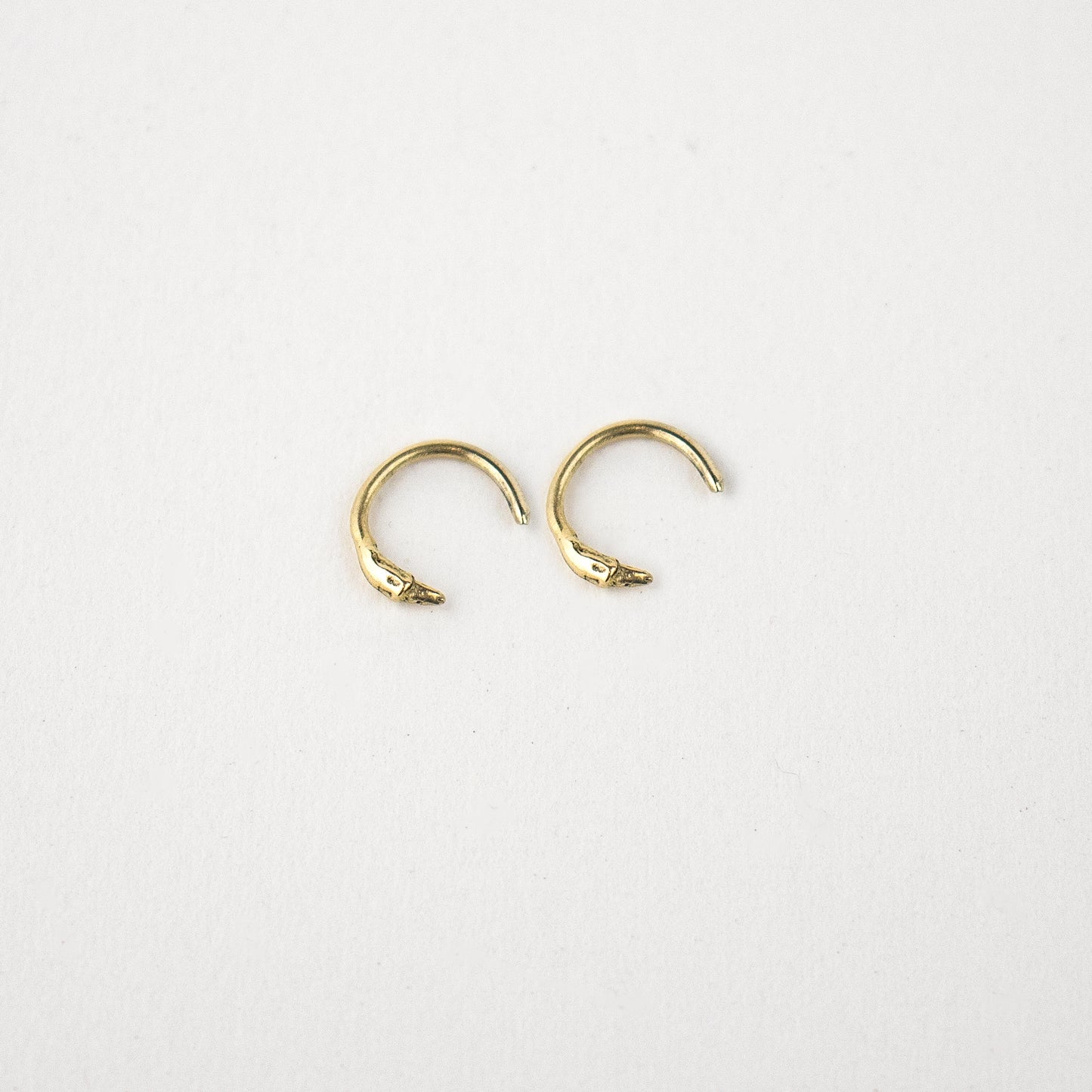 Solid reclaimed tiny 10k gold branch hug earrings handmade and finished in our Catskills store-studio and available as singles to mix-and-mat