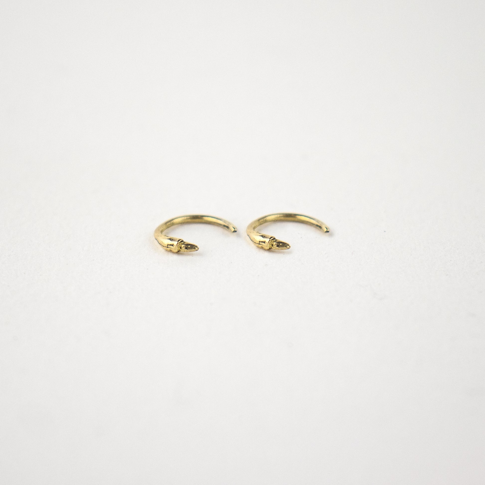 Solid reclaimed tiny 10k gold branch hug earrings handmade and finished in our Catskills store-studio and available as singles to mix-and-mat