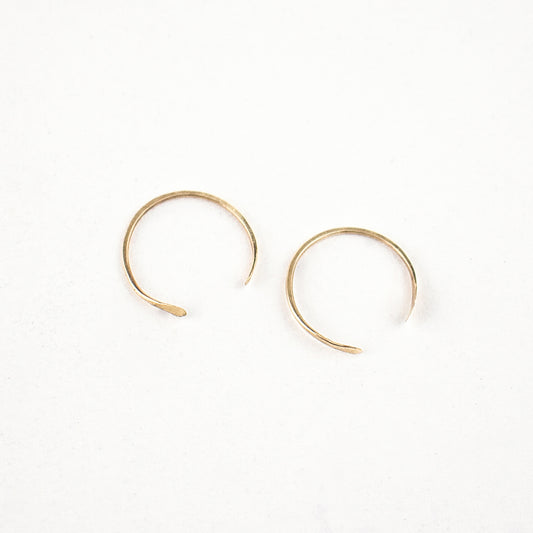 Solid reclaimed 10k gold hammer-finished open hoop earrings measuring 0.75 inches in diameter handmade and finished in our Catskills store-studio.