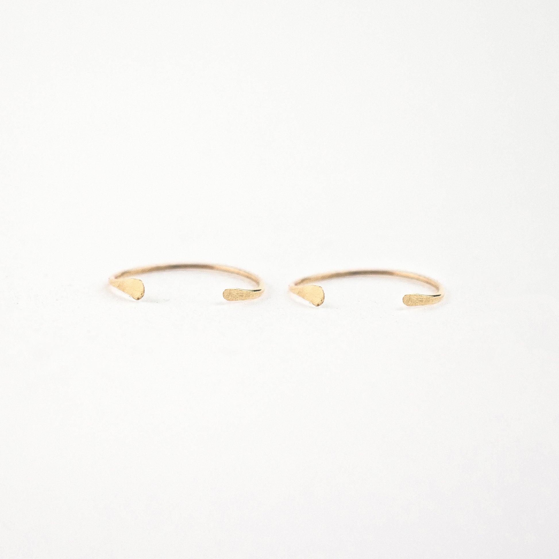 Solid reclaimed 10k gold hammer-finished open hoop earrings measuring 0.75 inches in diameter handmade and finished in our Catskills store-studio.