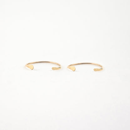 Solid reclaimed 10k gold hammer-finished open hoop earrings measuring 0.75 inches in diameter handmade and finished in our Catskills store-studio.