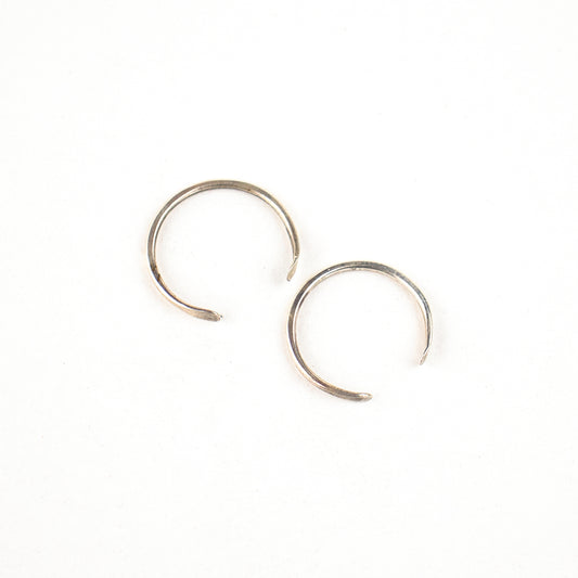 Solid reclaimed sterling silver hammer-finished open hoop earrings measuring 0.75 inches in diameter handmade and finished in our Catskills store-studio.