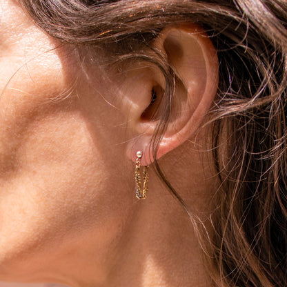 Reclaimed sterling silver and gold-filled tangled mixed-chain sterling hoop earrings handmade and finished in our Catskills store-studio shown on model.