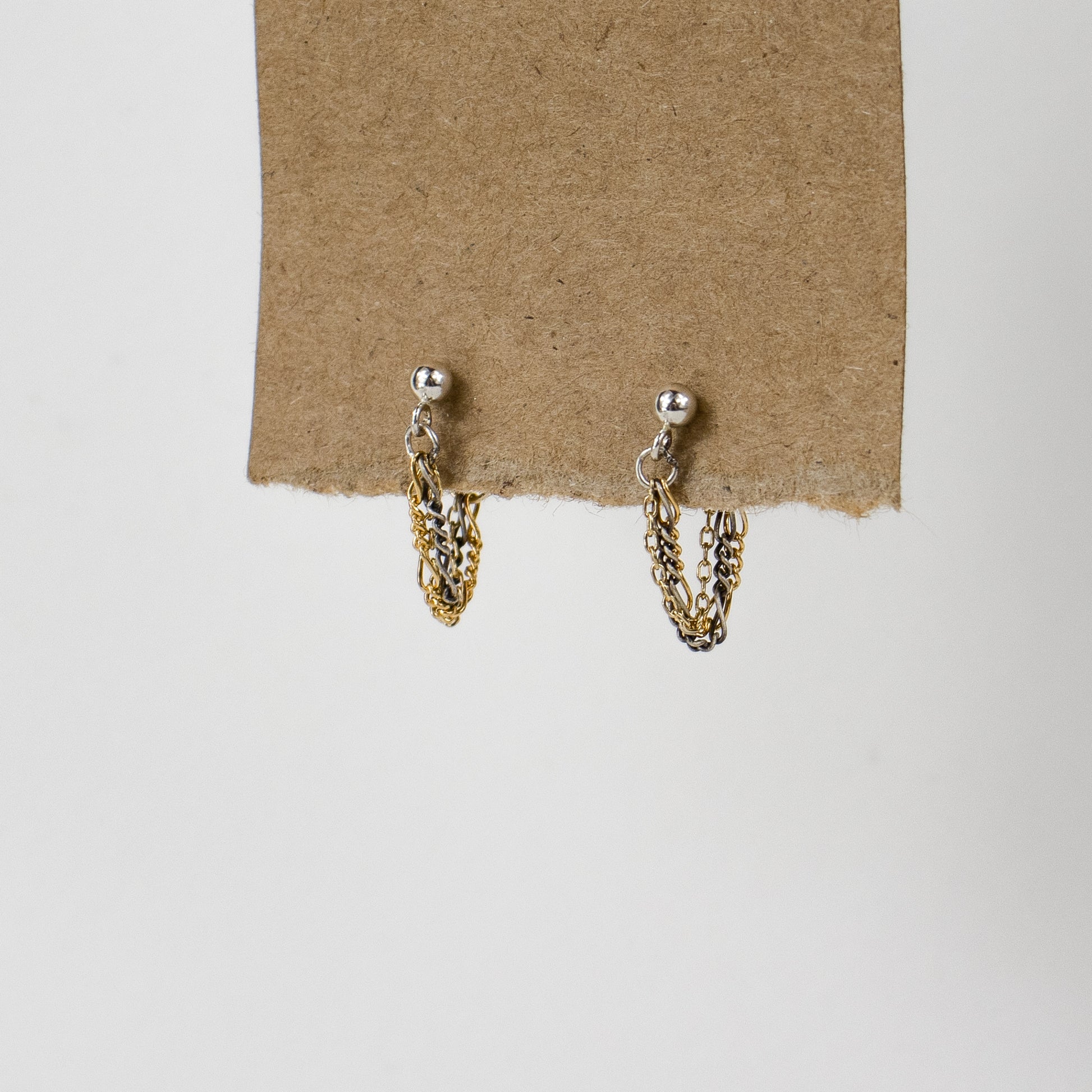 Reclaimed sterling silver and gold-filled tangled mixed-chain sterling hoop earrings handmade and finished in our Catskills store-studio.