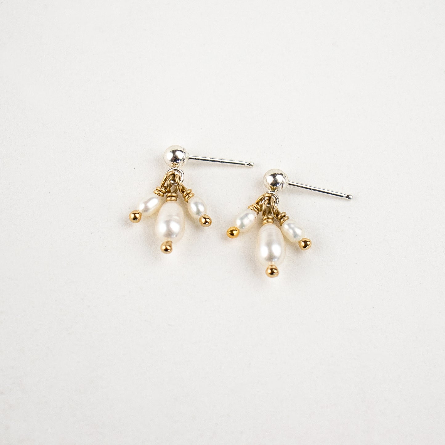 Reclaimed sterling silver stud earrings with three hand-beaded freshwater pearl teardrops handmade and finished in our Catskills store-studio.