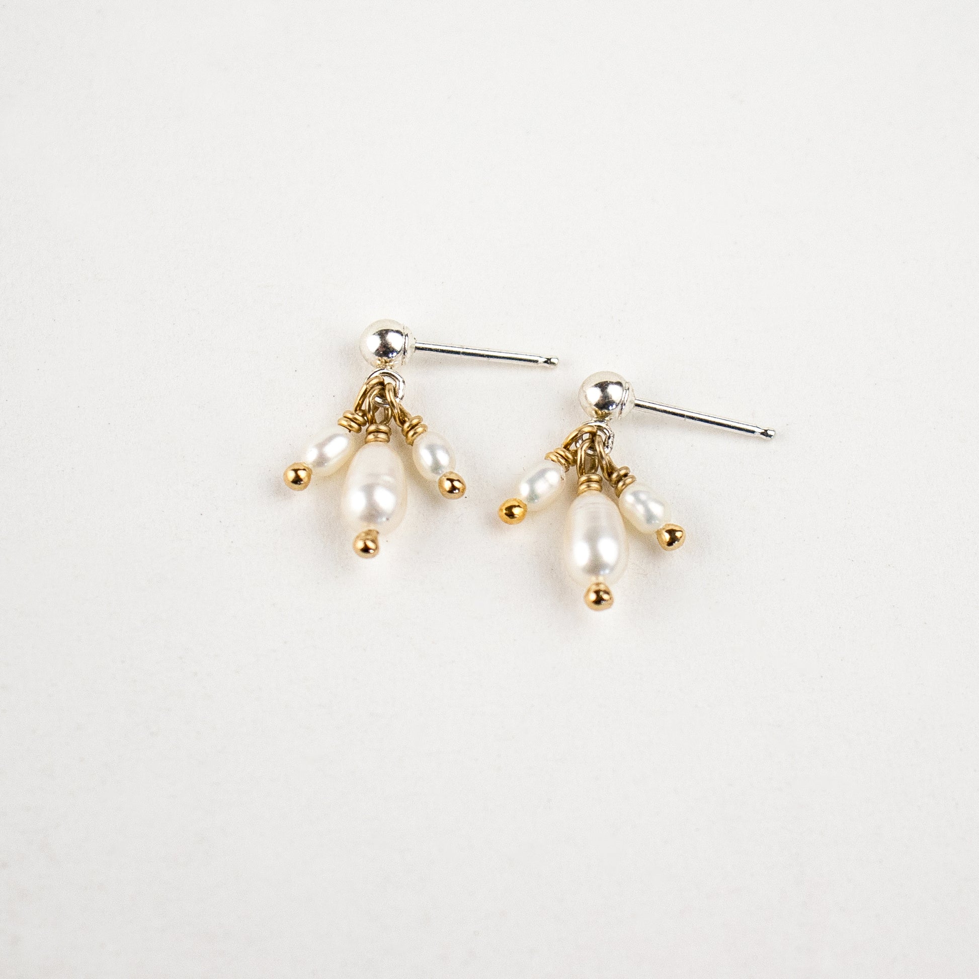 Reclaimed sterling silver stud earrings with three hand-beaded freshwater pearl teardrops handmade and finished in our Catskills store-studio.