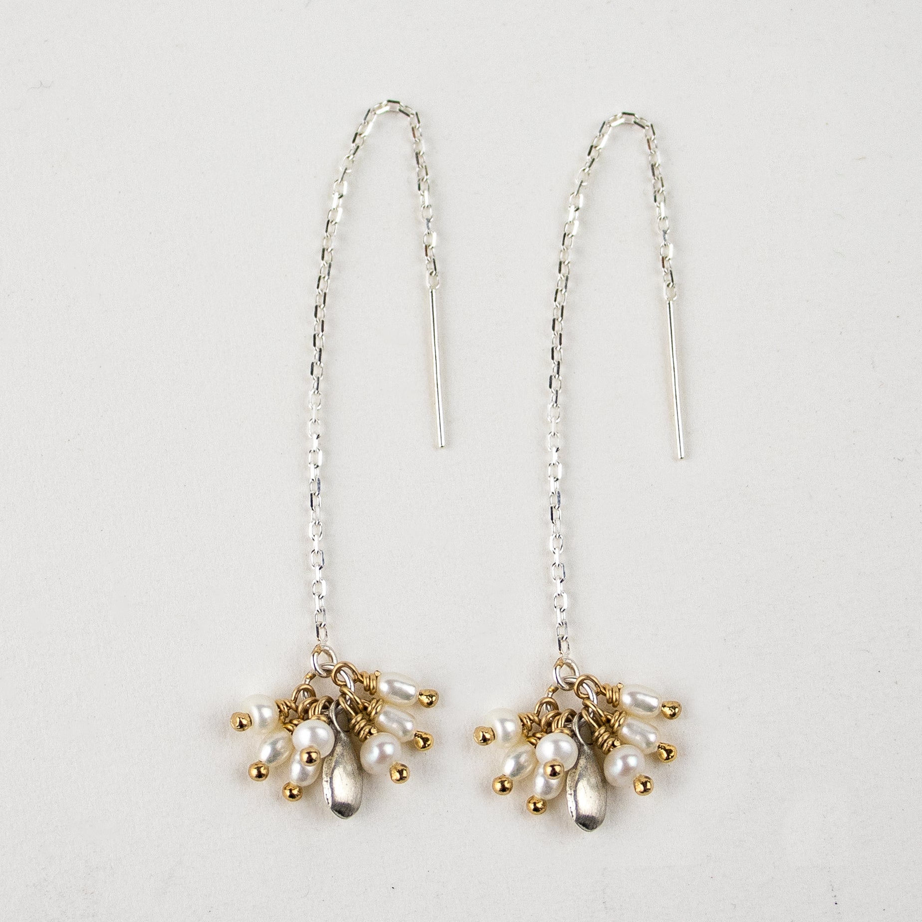 Reclaimed sterling silver threader earrings hand-beaded with seven freshwater pearl teardrops and sterling seed finished in our Catskills store-studio and available as singles to mix-and-match.