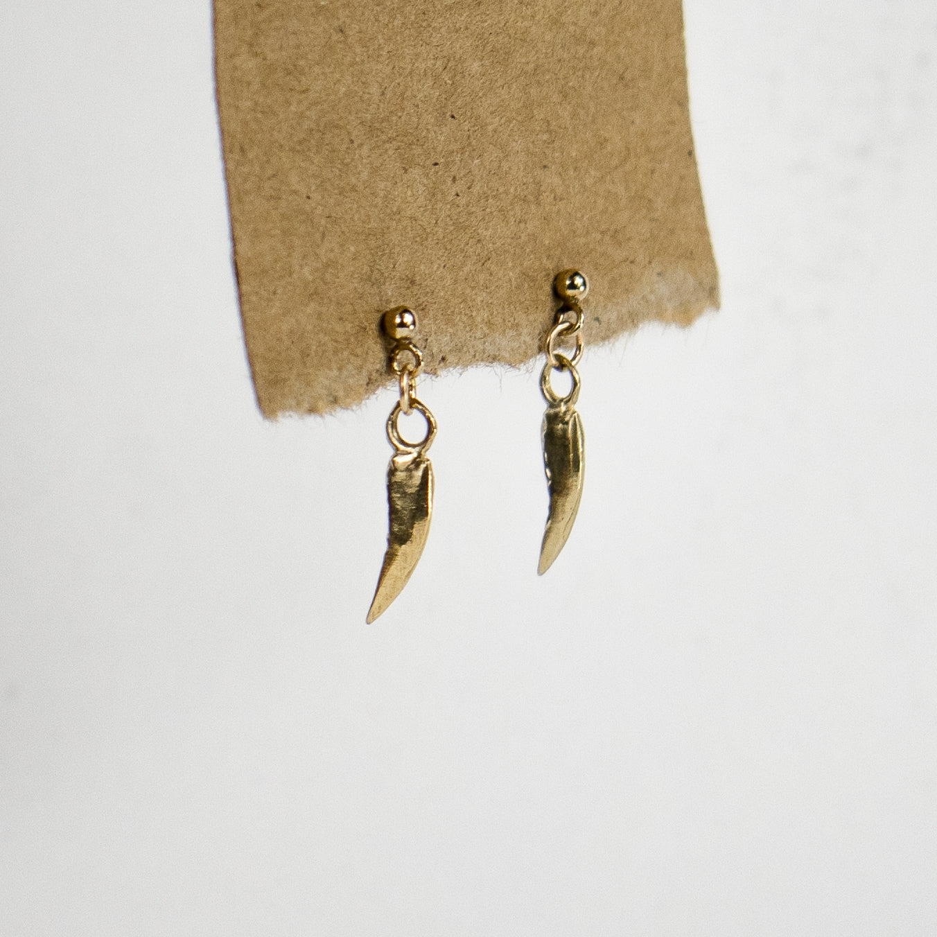 Dangling 10k solid reclaimed gold claw charms and jump-rings on gold-filled studs handmade and finished in our Catskills store-studio and available as singles to mix-and-match.