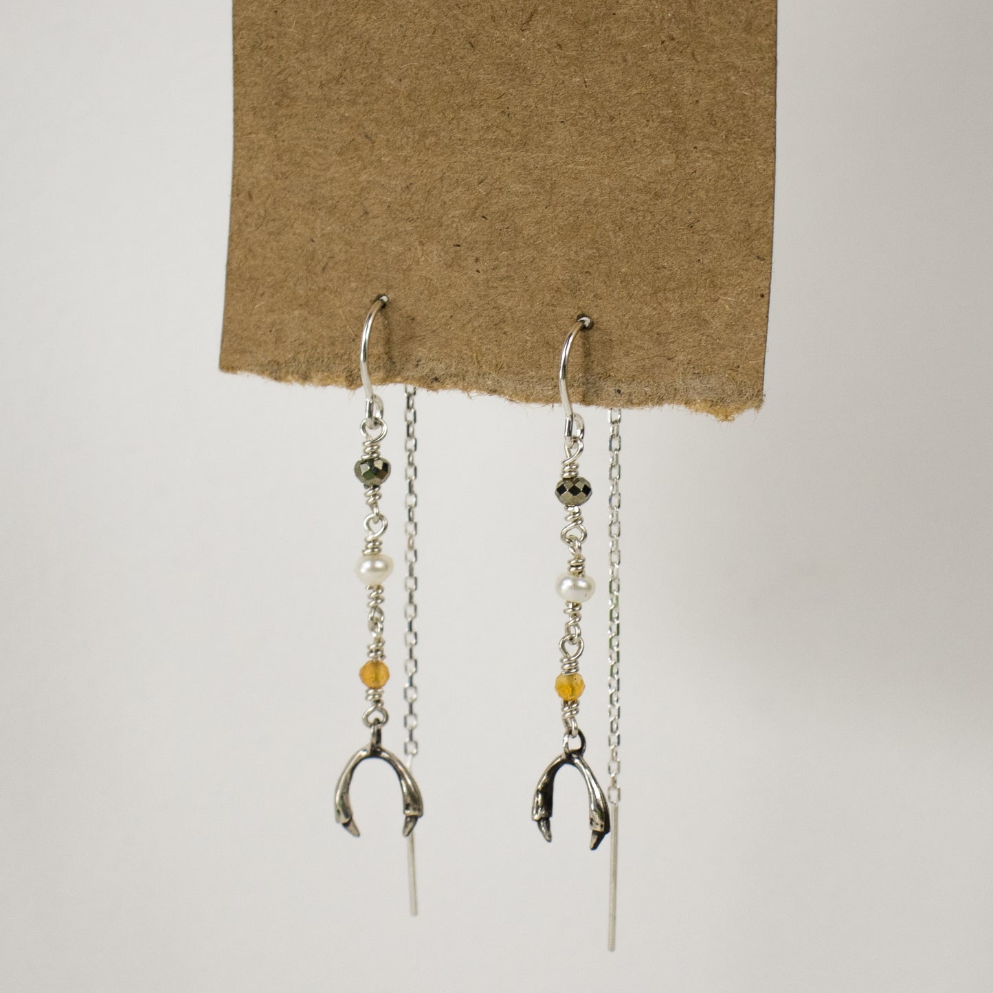 Sterling silver hooks and gold-filled wire threaders beaded with citrine, pyrite and one freshwater pearl, available with either solid reclaimed 10k gold or sterling silver horseshoe charms, handmade and finished in our Catskills store-studio and available as singles to mix-and-match.