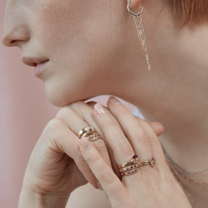 Reclaimed sterling silver hoops 1.5 inches in diameter with dangling gold-filled and sterling mixed-paperclip, fine and Figaro chains handmade and finished in our Catskills store-studio shown on model wearing 14 karat rings with precious stones.