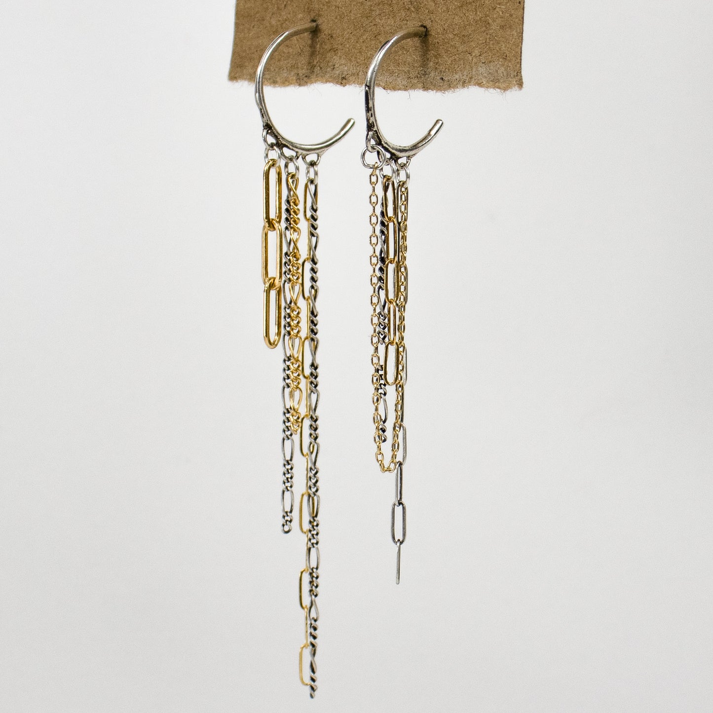 Reclaimed sterling silver hoops 1.5 inches in diameter with dangling gold-filled and sterling mixed-paperclip, fine and Figaro chains handmade and finished in our Catskills store-studio.