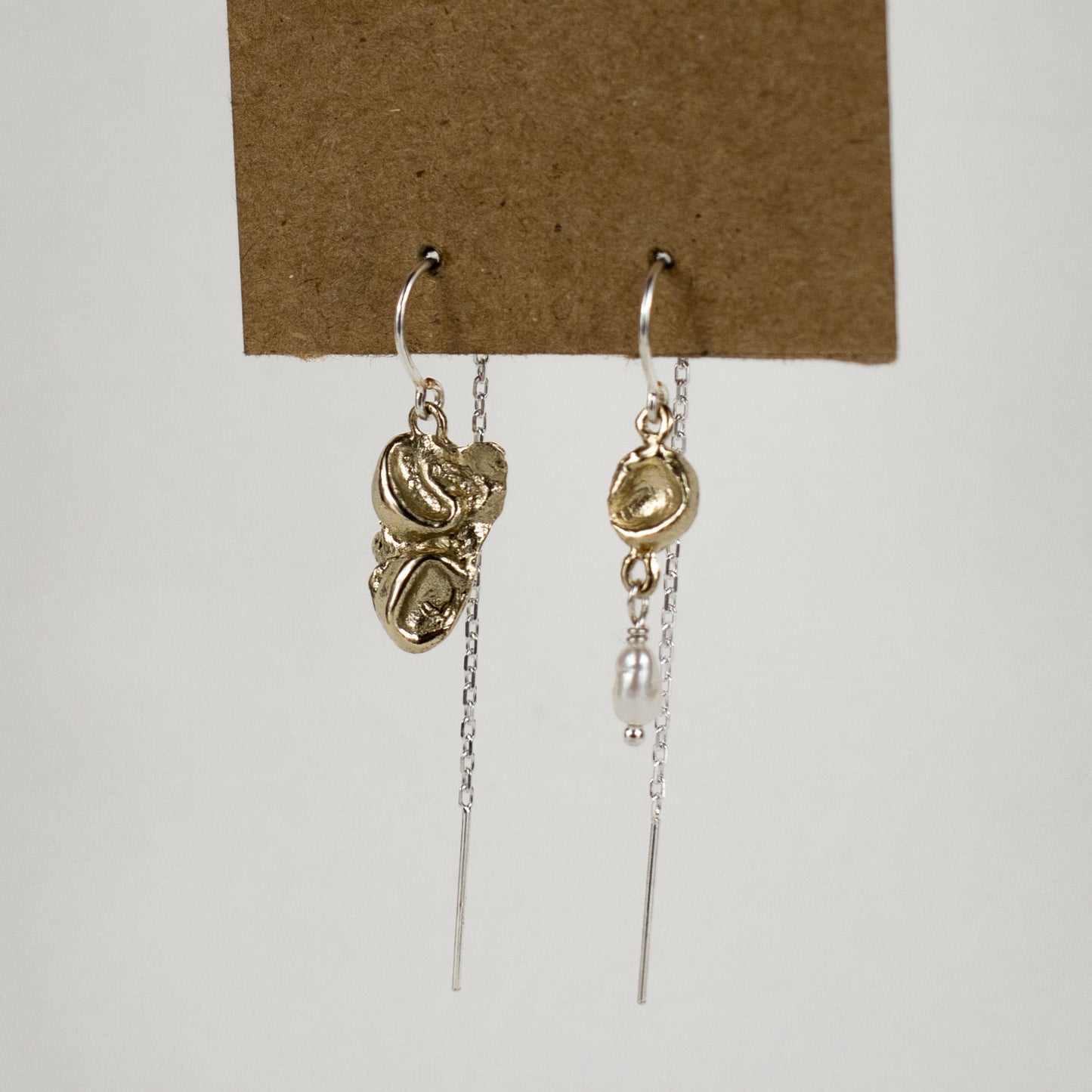 Reclaimed sterling silver or brass seaweed pods with a freshwater pearl drop dangling from sterling hooks and fine chain handmade and finished in our Catskills store-studio.