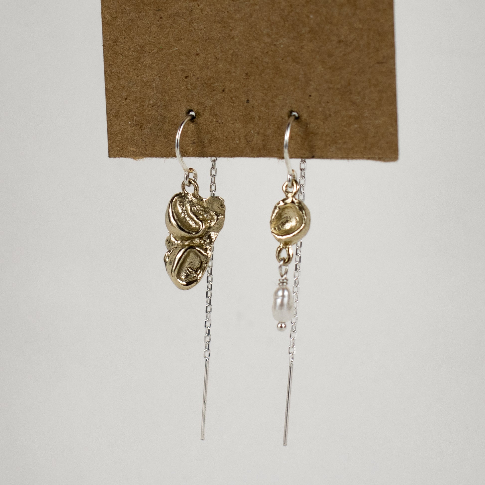 Reclaimed sterling silver or brass seaweed pods with a freshwater pearl drop dangling from sterling hooks and fine chain handmade and finished in our Catskills store-studio.