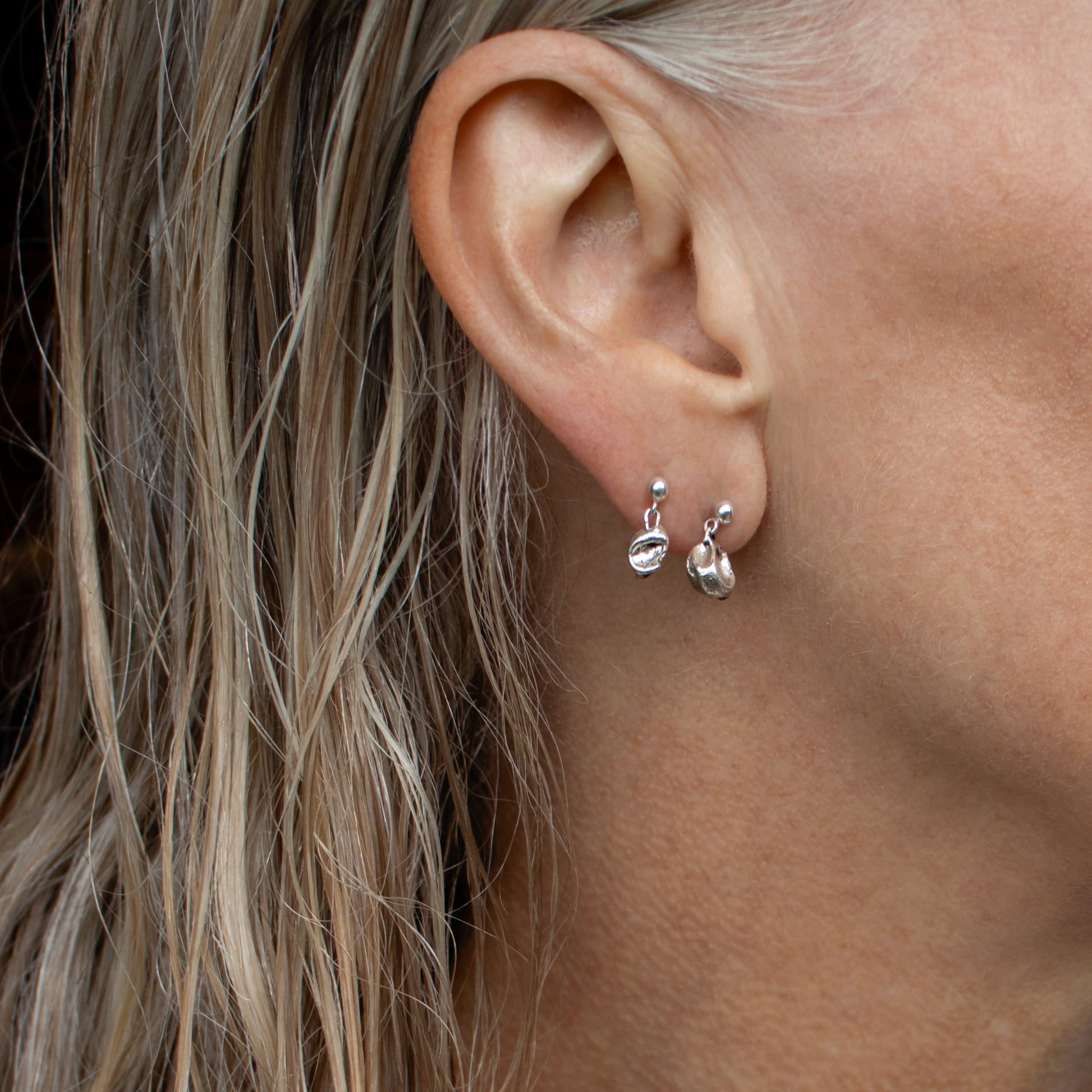 Small reclaimed sterling silver seaweed pods dangling from sterling studs&nbsp;handmade and finished in our Catskills store-studio shown on model.