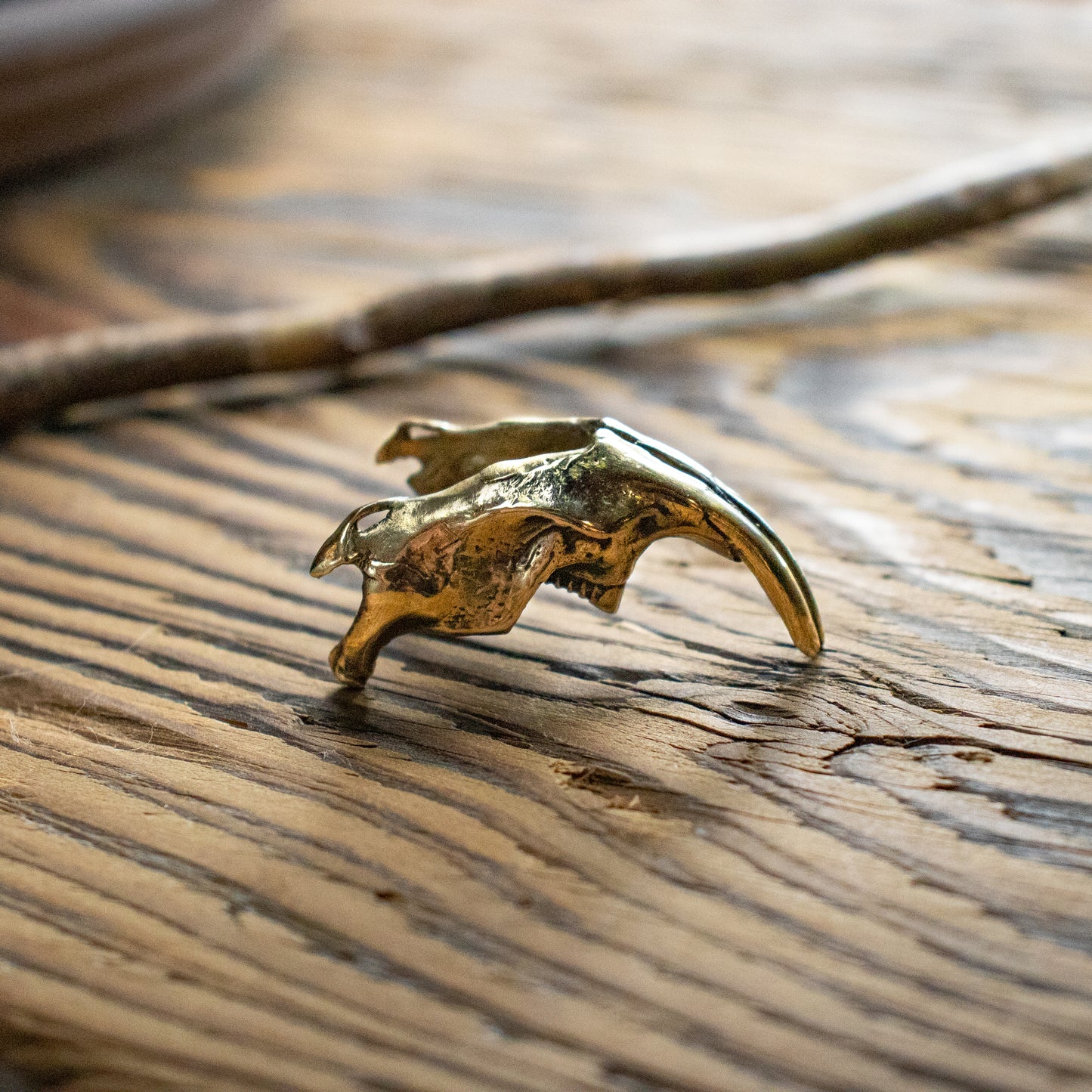 Solid reclaimed brass bird muskrat jawbone objet d' art measuring 1.75 inches long and finished in our Catskills store-studio.