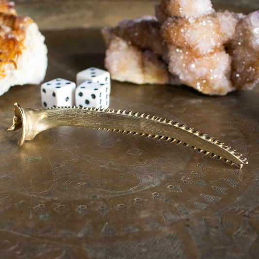 Solid reclaimed brass pectoral fish spine objet d' art measuring 5 inches long and finished in our Catskills store-studio.