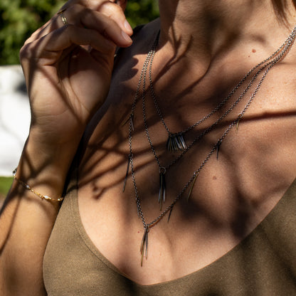 Solid reclaimed 10k gold and partially oxidized sterling silver snake spikes on sterling cable-chain adjustable 18 - 22 inches handmade and finished in our Catskills store-studio shown on model.