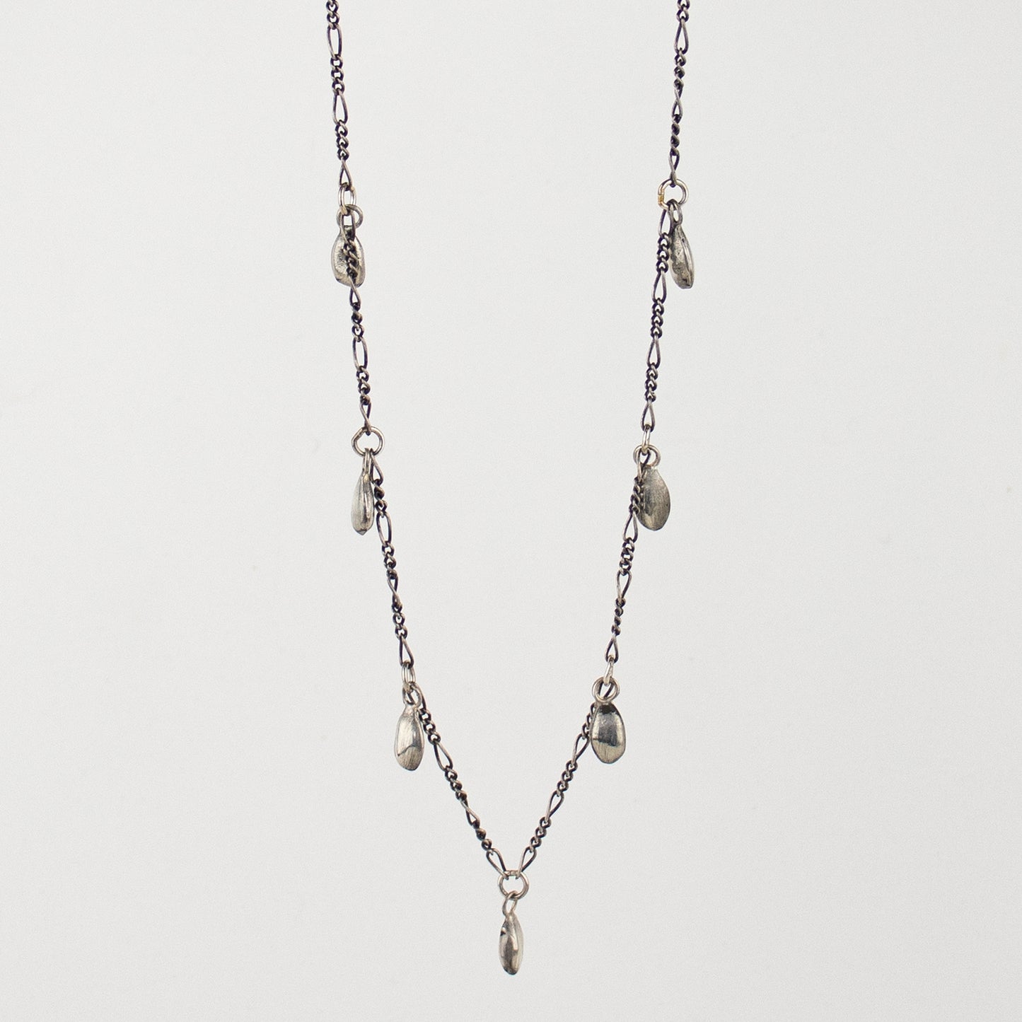 Seven solid reclaimed sterling silver seeds on sterling Figaro chain adjustable 16 - 20 inches and handmade and finished in our Catskills store-studio.