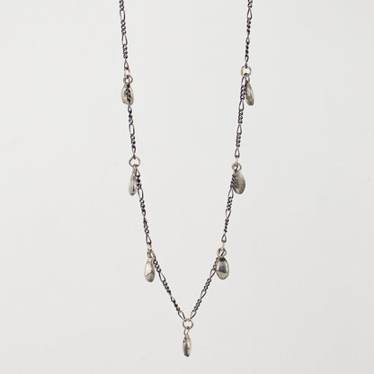 Seven solid reclaimed sterling silver seeds on sterling Figaro chain adjustable 16 - 20 inches and handmade and finished in our Catskills store-studio.