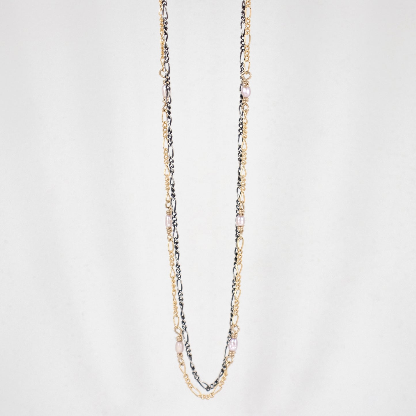 Double sterling silver and gold-filled Figaro chains adjustable 16 - 20 inches hand-beaded with white 2mm freshwater rice pearls handmade and finished in our Catskills store-studio.