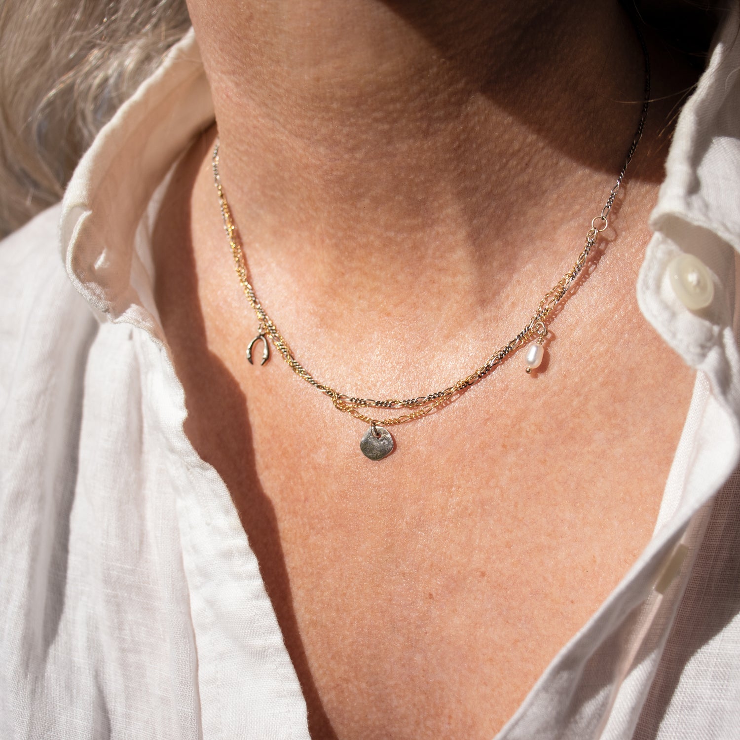 Two solid reclaimed sterling silver horseshoe and rock charms with freshwater pearl on tangled sterling and gold-filled chain adjustable 16 - 20 inches handmade and finished in our Catskills store-studio shown on model.