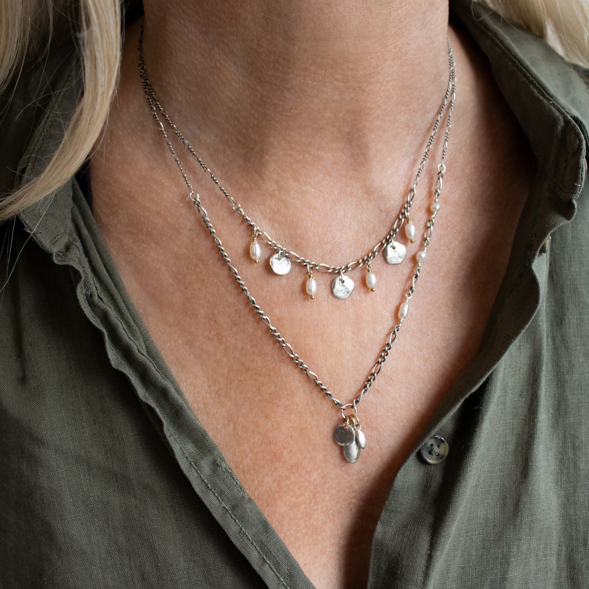 Three solid reclaimed sterling silver Maine rocks and four freshwater pearls on adjustable 16 - 20 inch sterling Figaro mixed-chain handmade and finished in our Catskills store-studio shown on model with necklace.