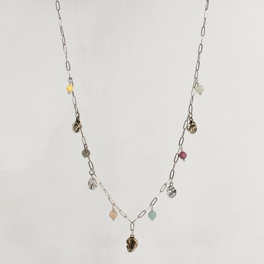 Five reclaimed brass seaweed pods, each measuring 5 mm, and six 4 mm multicolor beads on a fine sterling silver paperclip chain. Adjustable from 16–18 inches. Handmade and finished in our Catskills store-studio.