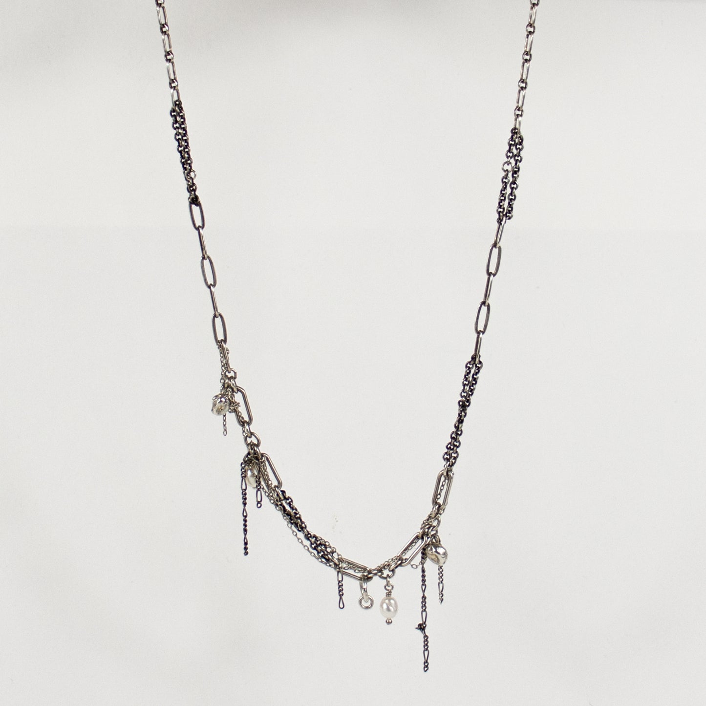 Reclaimed sterling silver seaweed pods, tangled silver chain, and freshwater pearls on sterling mixed-chain.