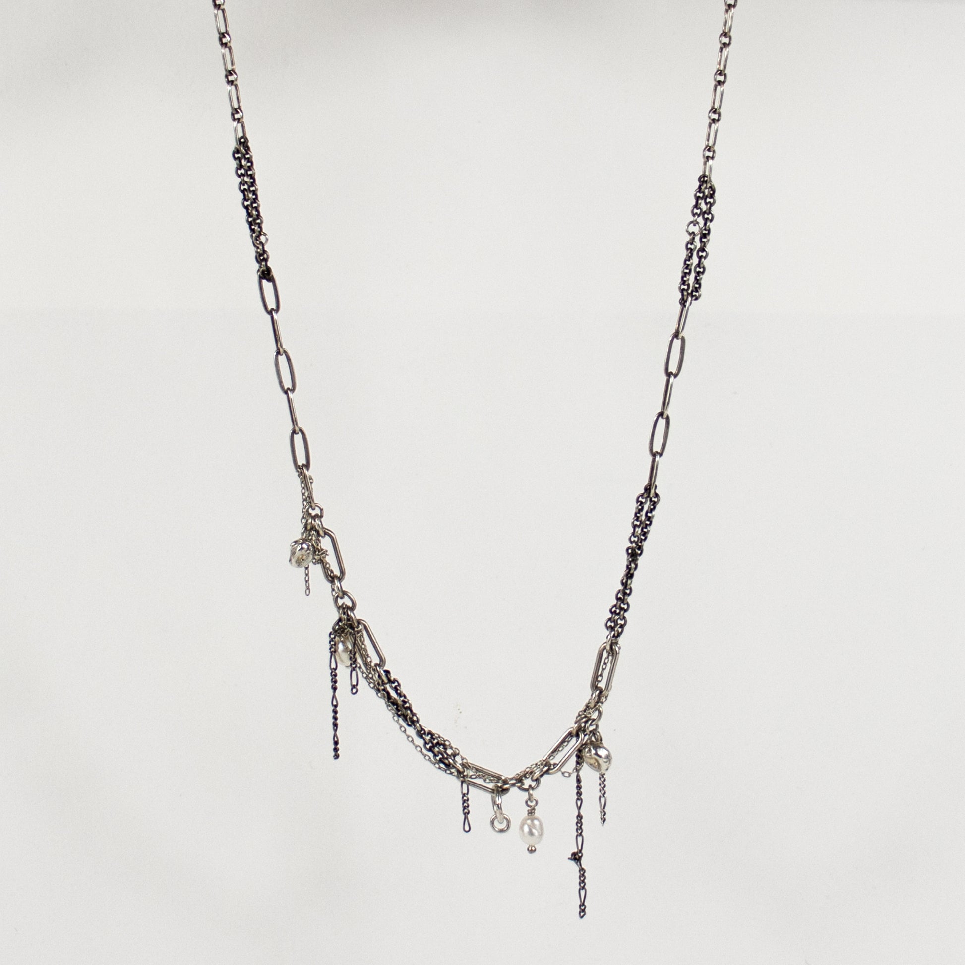 Reclaimed sterling silver seaweed pods, tangled silver chain, and freshwater pearls on sterling mixed-chain.