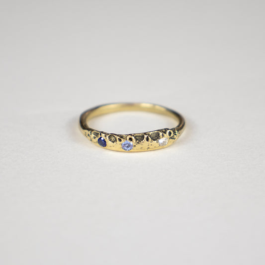 Small solid reclaimed 14k gold Vomer ring with a 3 - 3.5mm band-width set with two 2 mm blue sapphires and one 2 mm diamond.  Made-to-order and finished in our Catskills store-studio.