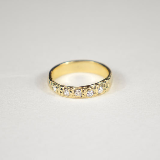 Solid reclaimed 14k gold Vomer ring with 4 mm band-width and set with five 2 mm traditional diamonds.