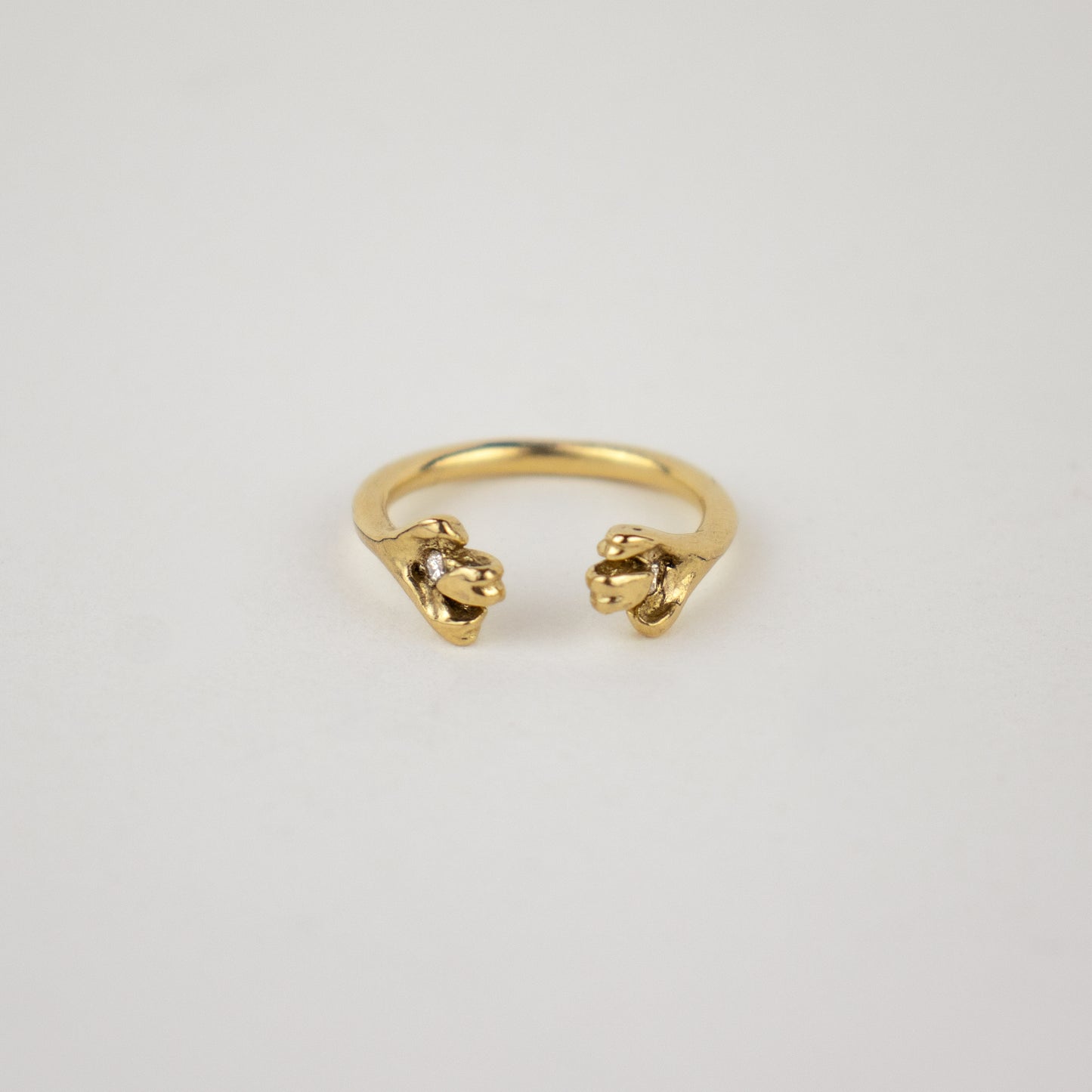 Solid reclaimed 14k gold femur ring set with two 2mm diamonds and adjustable for ring sizes 5 to 6.5 made-to-order and finished in our Catskills store-studio.