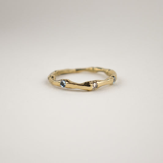 Solid reclaimed 14k gold muskrat spine ring set with two 2mm blue sapphires and a 2mm diamond.  Made-to-order and finished in our Catskills store-studio.