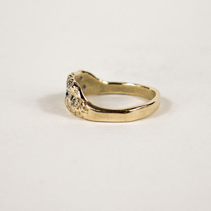 The Vomer bone of a fish jaw provides unique natural settings for this solid reclaimed 14k gold "statement ring" set with four 2 mm salt and pepper and three 1 mm champagne diamonds handmade and finished in our Catskills store-studio.