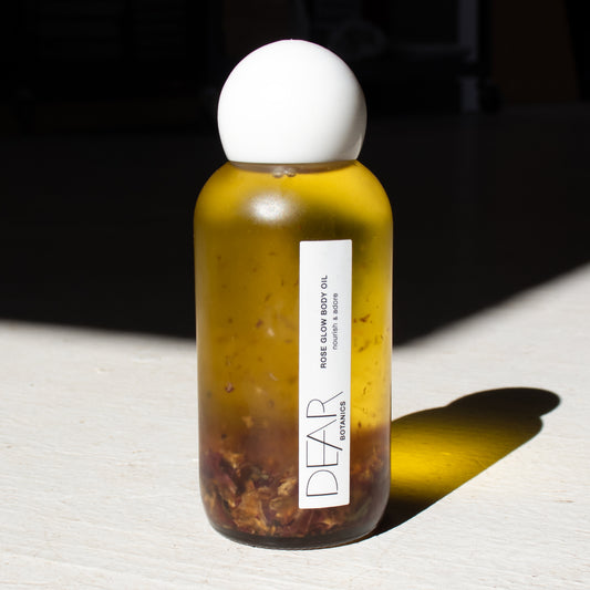 Dear Rose Glow Body Oil is handmade and bottled in Livingston Manor, NY offering almost all of the vitamins and minerals needed for healthy hair and skin while opening the heart chakra—Organic Apricot Kernel Oil, Organic Sweet Almond Oil, Organic Rose Geranium Essential Oil, Organic Red Rose Flower Buds.