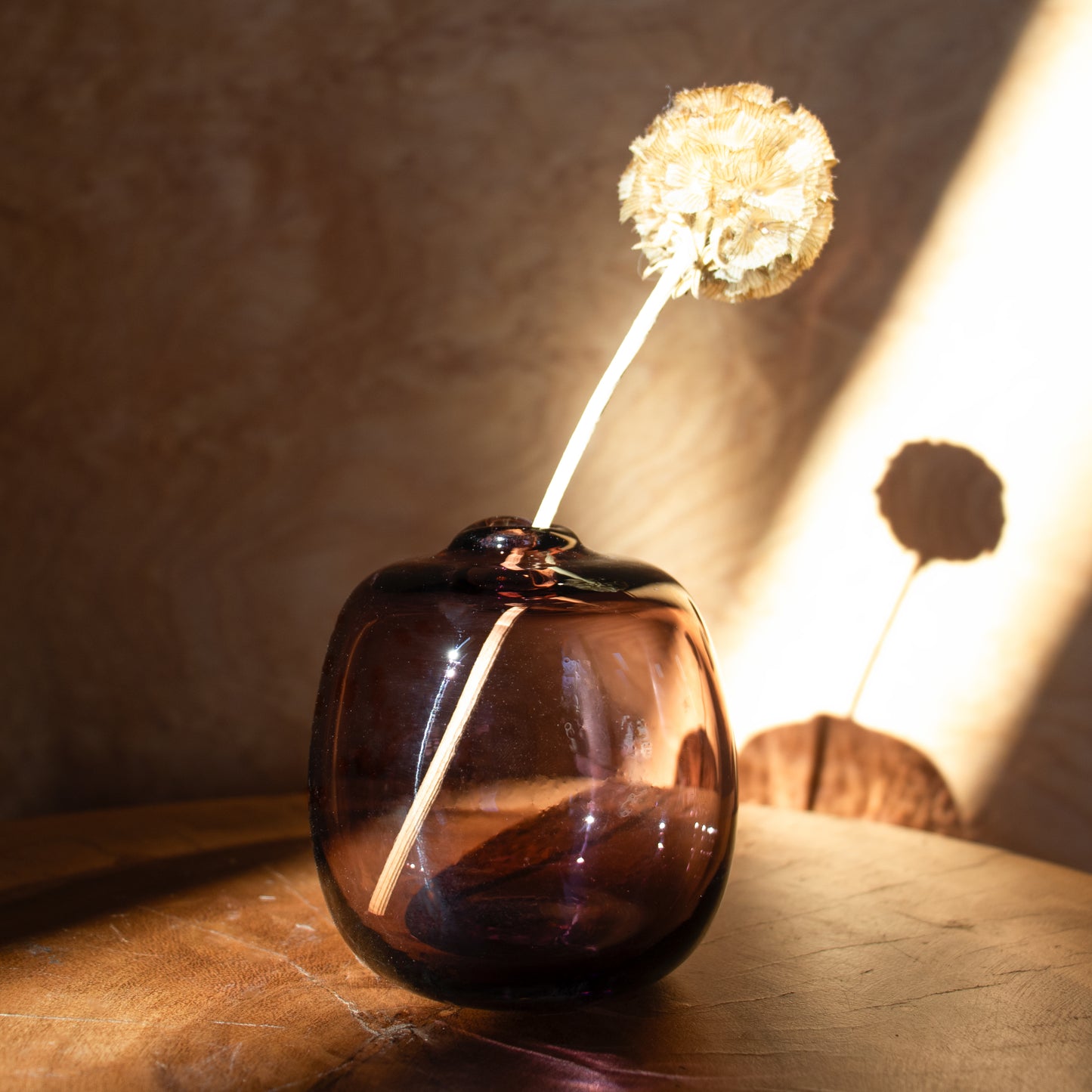 Little gem glass vases are handblown by Gary Bodker in his Portland, Oregon shop and catch light to pop with color. 3 x 3 inches.