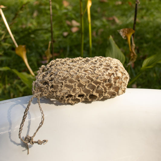 Hand-crocheted hemp exfoliating soap bag which is naturally mildew resistant and measures roughly 5.5 x 4.5 inches and is made in Los Angeles.