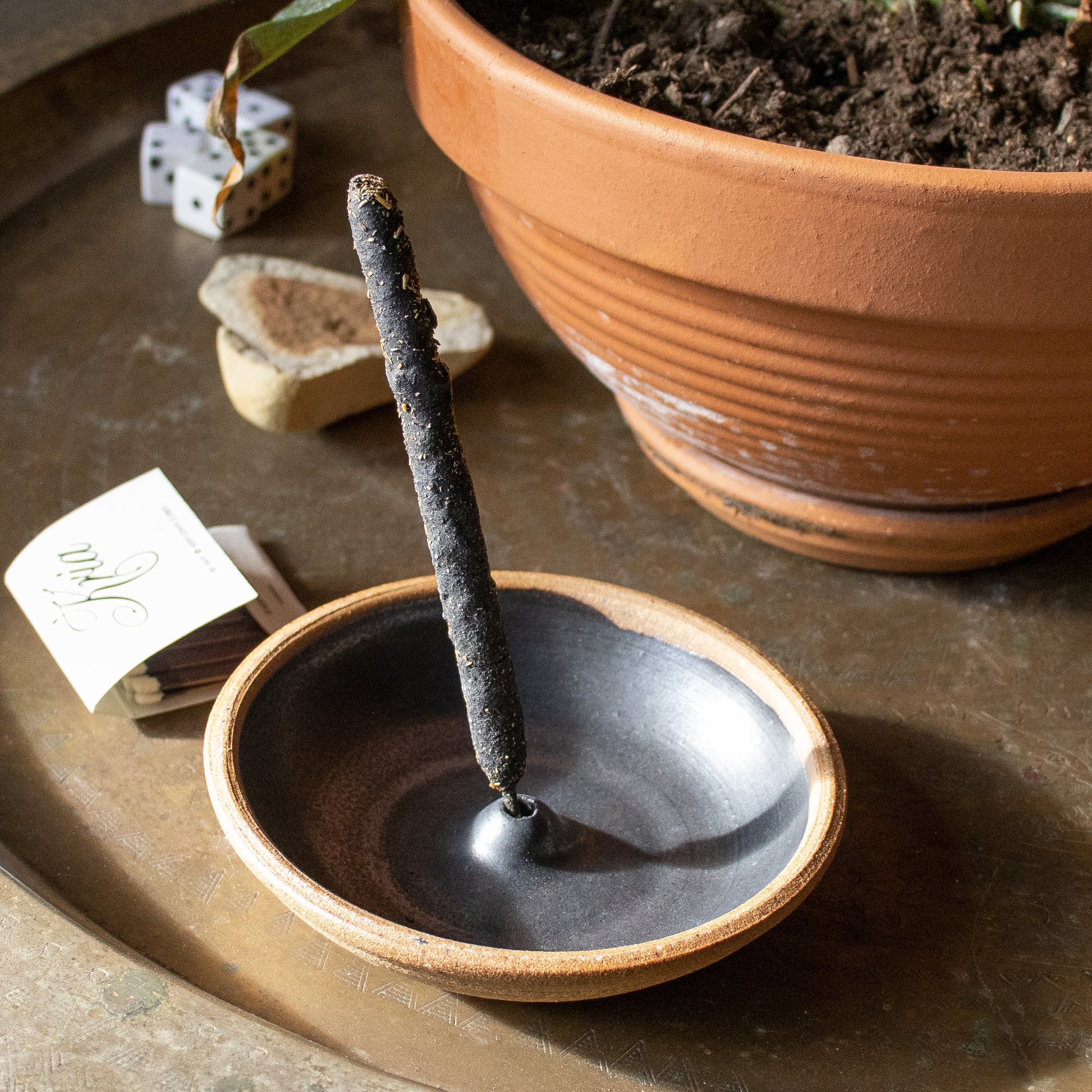 Elegant hand-thrown, northeastern stoneware clay incense burners wood-fired glazed on the inside and un-glazed on the outside available in cream or black and measuring 4.5 inches in diameter.
